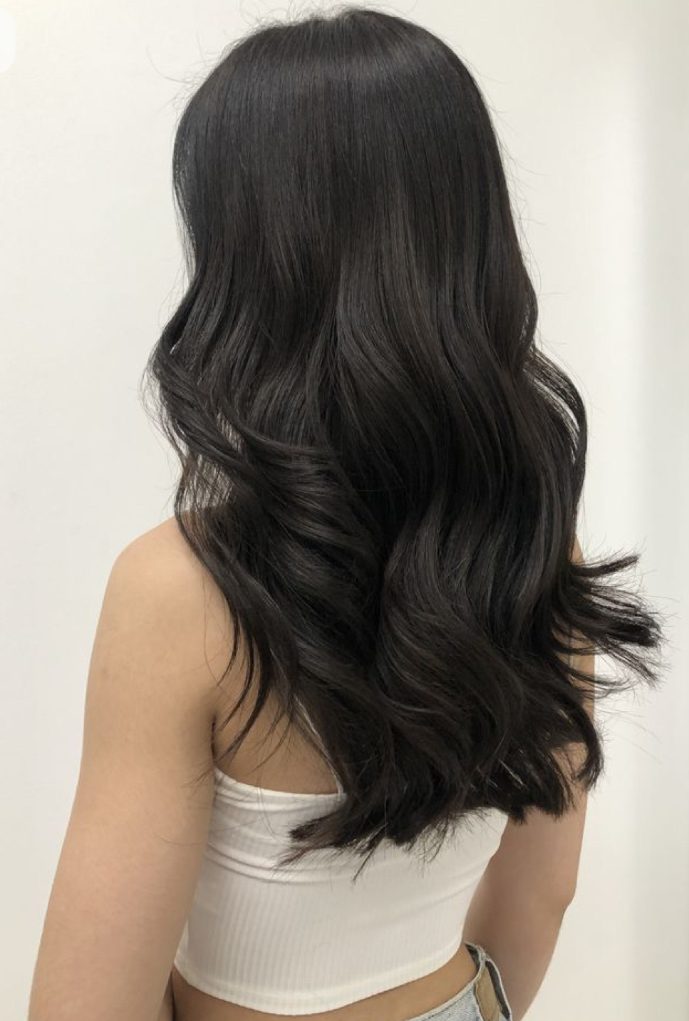 Client hair styled in soft black waves